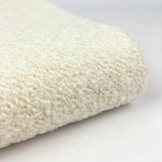 a close up view of a white blanket