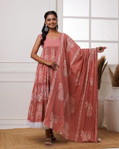 This coral mul-mul anarkali set is perfect for adding a pop of color to any occasion. Hand block printed for an exquisite finish, it features delicate lace work and a matching dupatta adorned with tassels. Crafted for both elegance and comfort, this set is the perfect addition to your wardrobe. No. of pieces - 3 piece set. Color - Coral. Fabric - Mul-Mul. Washing Instructions - Dry Clean. Bohemian Block Print Anarkali Set For Wedding, Bohemian Mulmul Sharara With Block Print, Bohemian Pink Cotton Anarkali Set, Bohemian Semi-stitched Mulmul Anarkali Set, Pink Bohemian Cotton Anarkali Set, Pink Block Print Unstitched Anarkali Set, Pink Block Print Mulmul Dupatta, Traditional Pink Anarkali Set With Block Print, Bohemian Pink Anarkali Set With Printed Motifs