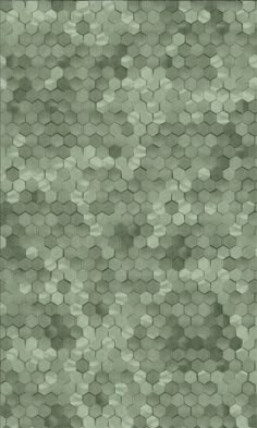 an abstract green background with hexagonal tiles in shades of light and dark grey