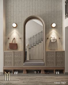 a large mirror sitting on top of a wooden cabinet next to a stair case in a living room