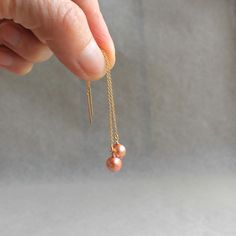 "Subtle and soft pink pearls dangle from delicate gold-filled threader ear wires.  Warm and golden. 3\" total length but can be adjusted ." Threader Earrings Gold, Pink Pearls, Gold Pearl Earrings, Coin Jewelry, Threader Earrings, Morning Light, Gold Earrings Dangle, Pink Pearl, Bridesmaid Earrings