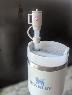 a white blender sitting on top of a counter