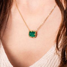 This pendant features a petite rectangular Emerald, with beautiful facets. This vibrant, one-of-a-kind stone is set in our signature handmade gold bezel pendant with braided detail and suspended from a matching gold chain. One of a Kind. Technical Details Metal: 18k yellow goldEmerald: 5.21 cts. Pendant Size: 10 x 12mmChain: can be worn at 16" and 18"Closure: lobster claspHandmade in New YorkStyle # N-3162-EM Luxury Gold Briolette Emerald Necklace, Luxury Briolette Emerald Necklace, Luxury Rectangular Pendant Gemstone Jewelry, Luxury Necklaces With Rectangular Gemstone Pendant, Luxury Bezel Set Emerald Necklace For Women, Luxury Oval Emerald Necklace With Natural Stones, Luxury Oval Emerald Birthstone Necklace, Luxury Emerald Gemstone Necklace With Rectangular Pendant, Luxury Gold Emerald Necklace With Natural Stones