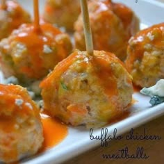 cheese balls with toothpicks on a white plate