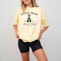 Show the world you're a proud dance mom in this adorable shirt! Made from quality materials, this shirt is soft, breathable, and comfortable. Please refer to size and color charts when selecting color. Certain styles are only available in certain colors. Feel free to message us for any special requests, or questions!  Wash instructions: Wash inside out with like colors. Hang dry, or tumble dry on low. Do not iron. Casual Crew Neck T-shirt For Dance Class, Cotton T-shirt With Letter Print For Dance Class, Casual T-shirt With Letter Print For Dance Class, Cotton Graphic Tee For Dance Class, Casual Graphic Print T-shirt For Dance Class, Cotton Hip Hop T-shirt For Dance Class, White Relaxed Fit Top For Dance Class, Casual Text Print T-shirt For Dance Class, Casual T-shirt With Text Print For Dance Class