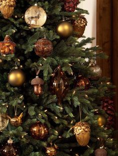 a christmas tree with gold and silver ornaments