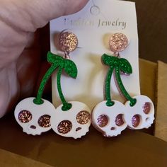 Fun Earrings That Look Like Cherry Skulls. Great For Halloween Or Anytime You Feel Sweet And Spooky. Sparkly Green Stems And Pink Sparkly Skull Eyes. Lightweight Hard Vinyl. White Halloween Party Jewelry, White Novelty Jewelry For Party, Novelty White Jewelry For Party, White Novelty Party Jewelry, White Skull Print Jewelry For Gift, White Skull Print Jewelry Gift, Fun White Jewelry For Halloween, Fun White Halloween Jewelry, Fun White Party Jewelry