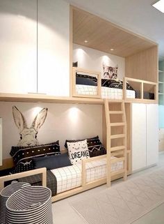 a bedroom with bunk beds and white walls