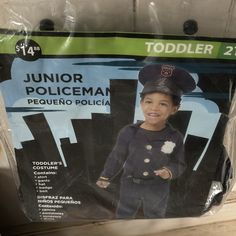 a package of toddler police uniforms on display