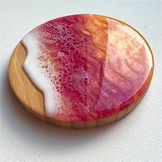 a pink and white plate sitting on top of a table