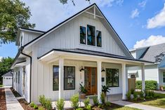 a white house with black trim and windows