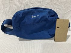 The Nike Aura Crossbody Bag is the perfect accessory for any occasion. With a zip closure, this unisex waist bag is ideal for travel or casual wear. Measuring 18cm x 12cm x 7.5cm / 7.1" x 4.7" x 3.0" inches, it's the perfect size for carrying all your essentials. Made from nylon and polyester, the exterior is durable and the lining is made from nylon and polyester. The bag is designed with a galaxy blue exterior color and comes with a waist strap for easy carrying. The Nike Aura Crossbody Bag is the perfect addition to any Nike Aura collection. Smoke/Pet free home! Blue Exterior, Waist Strap, Waist Pack, Waist Bag, Exterior Colors, Casual Bags, Christmas List, Bags Handbags, Aura