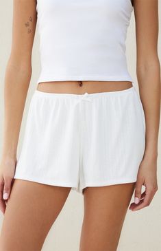 Beverly and Beck offers comfort and style in their new Pointelle Shorts. These classic low-rise shorts are crafted from a pointelle fabrication and feature an elastic waistband, a bow detail at the front, and a relaxed fit. 


	9.5" rise
	2.5" inseam
	Lined
	Good stretch
	Pointelle fabric
	Low-rise
	Elastic waistband
	Bow front detail
	Relaxed fit
	85% polyester, 15% rayon; Lining: 100% polyester
	Machine washable
	Model is wearing a size small Pointelle Shorts, Pointelle Fabric, Bow Shorts, Low Rise Shorts, Good Stretches, Bow Detail, Beck, Dream Wardrobe, Pacsun