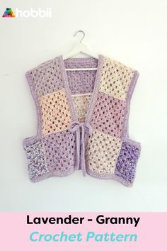 a crocheted vest hanging on a wall with the words lavender granny written below it