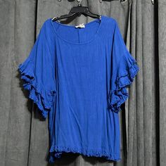 Umgee Brand New With Tags. Royal Blue Blouse With Flare Ruffle Sleeves Blue Ruffle Hem Top For Beach, Blue Flowy Tops With Ruffle Sleeves, Blue Flowy Top With Ruffle Sleeves, Flowy Blue Top With Ruffle Sleeves, Blue Flutter Sleeve Tops With Ruffle Hem, Blue Tops With Ruffle Hem And Flutter Sleeve, Blue Ruffle Sleeve Tops For Vacation, Blue Bohemian Blouse With Ruffle Sleeves, Bohemian Blue Blouse With Ruffle Sleeves