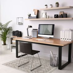 an office with a desk, chair and bookshelf