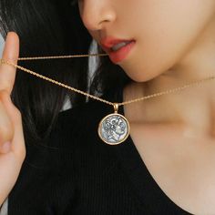 Introducing our "Classic Alexander Silver Coin Plus Necklace" – a timeless and sophisticated piece that adds a touch of vintage charm and elegance with its dual-layer design and adjustable length. Elevate your style with this versatile and stylish accessory. Metal: 18K Recycled Gold Plated Vermeil on Recycled Sterling Silver/Recycled Sterling Silver Pendant Dimensions: Length 40mm Length: 590-650mm Classic 14k Gold Coin Pendant Jewelry, Classic 14k Gold Jewelry With Coin Pendant, Elegant Sterling Silver Gold-tone Necklace, Elegant Gold-tone Sterling Silver Chain Necklace, Vintage Gold-plated Jewelry, Timeless 14k Gold Coin Pendant Necklace, Classic Gold Plated Clavicle Chain Necklace, Timeless Gold Engraved Coin Necklace, Silver Brass Fine Jewelry Necklace