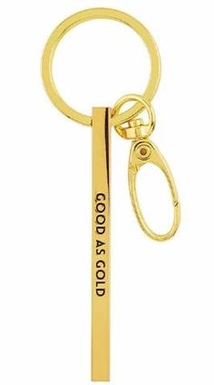 a gold keychain with the words good news on it and a metal bar attached to