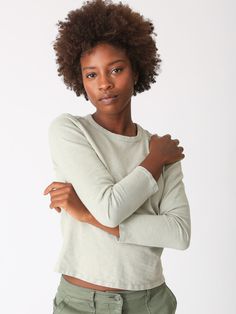 A wardrobe classic, our Faye long-sleeve tee is perfect to layer or wear on its own. Made from the softest cotton it will be a closet staple for you. We love it paired equally with our Easy Pant or Simone Skirt. Fabric: 100% Cotton . Color-way: Cool Sage. Model is 5'9" and wearing size small. Machine wash. Tumble dry on low. Made in the USA. Effortless Crew Neck Tops For Fall, Relaxed Everyday Tops For Fall, Spring Long Sleeve T-shirt For Loungewear, Everyday Crew Neck Long Sleeve Top With Thumbholes, Effortless Cotton Tops For Fall, Crew Neck Long Sleeve Cotton Top With Thumbholes, Cotton Long Sleeve Crew Neck Top With Thumbholes, Cotton Long Sleeve Top With Thumbholes And Crew Neck, Relaxed Long Sleeve Tops