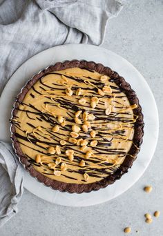 a chocolate peanut butter pie on a white plate