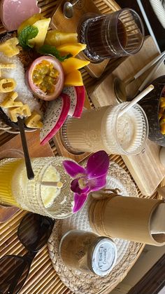 a table topped with plates and glasses filled with food