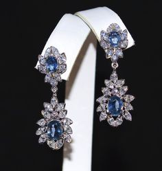 "Estate 18k solid gold 8.39cts diamond and blue sapphire earrings f-g color and vs clarity untreated natural diamond solitaires and huge untreated un-filled natural sapphires. extremely high end - top quality earrings description: these are custom made top quality sapphire and diamond earrings. the earrings are loaded with 0.21cts of large round brilliant cut and 3.64cts of large marquise cut natural diamonds and 4.54cts of large oval shape faceted natural blue sapphires . the earrings have 3.85 Formal Dangle Cluster Earrings In Fine Jewelry Style, Formal Hand Set Cluster Drop Earrings, Formal Dangle Cluster Earrings Fine Jewelry, Hand Set Cluster Drop Earrings For Formal Occasions, Oval Sapphire Earrings With 17 Jewels, Formal Hand Set Cluster Earrings Fine Jewelry, Formal Fine Jewelry Earrings With Hand Set, Fine Jewelry Hand Set Earrings For Formal Occasions, Formal Fine Jewelry Earrings Hand Set