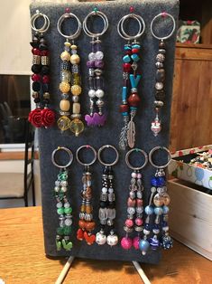 a bunch of jewelry hanging on a rack