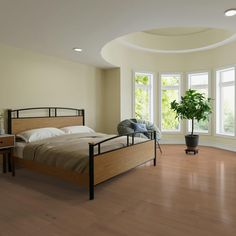 a bed room with a neatly made bed and a potted plant in the corner