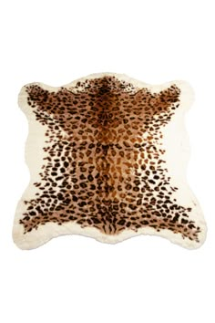 a brown and white animal print rug with spots on it's back, in the shape of a star