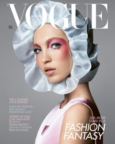 a magazine cover with a woman wearing a white hat and pink makeup on the face