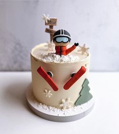 a decorated cake with a skier on top