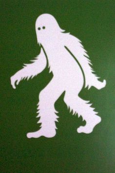 a bigfoot sticker is on the side of a green toilet paper dispenser