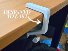 the corner of a desk with an arrow pointing to it