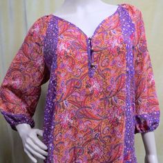 Nwt New Retail $59.00 Ladies Semi Sheer Lightweight Chiffon Pullover Boho Peasant Style Tunic Top. Purple, Orange, Pink, Hunter Green, Paisley Floral Print. Puffy Elastic Cuff 3/4 Length Sleeves, Buttoned V-Neckline. Chest Is 19" Across Front Unstretched And Length 27.5" Shoulder To Hem. Made Of 100% Polyester. Machine Washable. Spring Purple Half-sleeve Blouse, Spring Purple Half Sleeve Blouse, Summer Purple Half Sleeve Blouse, Purple 3/4 Sleeve Blouse For Spring, Casual Purple Blouse With 3/4 Sleeves, Beach Purple Printed Blouse, Casual Purple Blouse 3/4 Sleeve, Printed Purple Blouse For Vacation, Purple Printed Blouse For Vacation