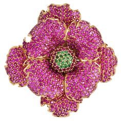 Presenting a Designer statement Brooch Pin by Sonia Bitton hand-crafted in 14K yellow gold with genuine pink sapphires and Tsavorite gemstones. The three-layer flower motif brooch is decorated with precious natural round Pave Pink Sapphires and Green Tsavorite gemstones.  Natural Pink Sapphire Approximately Over 20 carats  Natural Round Green Tsavorite Approximately 0.75 carats Signed: Sonia. B 14K   Measurements: 2.5" x 2.5" Weight: 54.2 Grams Condition: Excellent Accompanied by a Professional Luxury Pink Wedding Brooches, Luxury Pink Brooches For Wedding, Luxury Pink Brooch For Wedding, Luxury Pink Brooch Jewelry, Fabric Brooch, Flower Motif, Flower Pins, Flower Brooch, Pink Sapphire