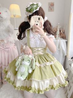 This stunning Lolita skirt features a charming green and white color scheme, accentuated by a lace-up front and a high waist design for a flattering fit. The detachable straps add a versatile touch, allowing you to customize your look. Embrace the sweet and elegant Lolita style with this beautiful skirt that is perfect for any occasion.   	 		 			Size 			S 			M 			L 		 		 			Waist 			58-82 			64-88 			72-94 		 		 			Full Length 			43 			44 			45 		 		 			Hem Circumference 			426 			426 			426 Green Ruffled Dress With Skirt Shape, Spring Green Bottoms With Lace Trim, Green Mini Skirt With Ruffles, Summer Green Skirt With Lace Trim, Kawaii Ruffled Skirt For Spring, Spring Kawaii Skirt With Ruffles, Harajuku Style Ruffled Mini Skirt For Spring, White Fairy Kei Mini Skirt, White Fairy Kei Skirt With Ruffles