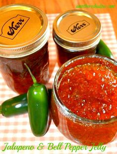 three jars of jalapeno and bell pepper jelly on a checkered tablecloth