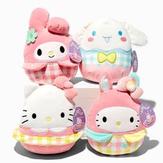 hello kitty stuffed toys are stacked on top of each other