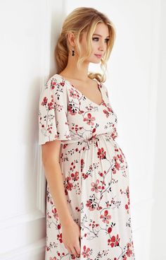 Our new Japanese inspired cherry blossom print works fabulously in our Kimono inspired maternity dress. Loose fitting longer sleeves and a subtle v neckline are beautifully matched with our nude fabric and easy to wear black and red print. Cut from premium French jersey with a remarkable fit and drape, our stunning dress works day to night with ease. The beautiful finishing touch – a chic side split for ease of movement and added flair! -Japanese kimono dress -Nude printed floral -Chic side spli Fitted V-neck Maternity Dress With Floral Print, Red V-neck Maternity Dress, Feminine Maternity Dress With Floral Print, Fitted Floral Print V-neck Maternity Dress, Fitted Maternity Dress With Floral Print And V-neck, Fitted V-neck Floral Print Maternity Dress, White Floral Print Maternity Dress, Spring Floral Print V-neck Maternity Dress, Spring V-neck Floral Print Maternity Dress