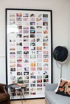 a living room with white walls and pictures on the wall