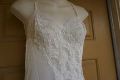 "Vintage maxi nightgown labeled size M. By Val Mode. In good vintage condition no flaws to note. Stretchy Measurements taken across front laid flat 16\" across front armpit to armpit 14.5\" across waist 57\" length" Vintage Nightgown With Delicate Lace For Wedding Night, Vintage Lace Nightgown For Sleep, Vintage White Lace Nightgown, White Lace Vintage Nightgown, Summer Lace Nightgown With Lace Bodice, Vintage Lace Sleepwear With Delicate Detail, Vintage Lace Camisole Sleepwear, Vintage Sheer Lace Nightgown, Vintage Lace Sleepwear For Home