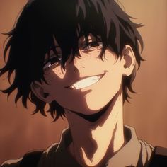 a man with black hair and glasses smiling