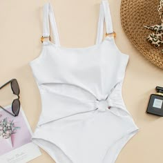 The push up hollow out one piece monokini is a must-have for your summer beach days. Its stylish design and flattering fit make it a standout choice. With its comfortable and durable material, you'll feel confident and chic all day long. Shop now for the ultimate swimwear upgrade. Solid Color Bikinis, White Bathing Suit, Cut Out One Piece, Costume Intero, Swimming Costume, Beach Wear Dresses, Swim Fashion, One Piece Swim, Monokini