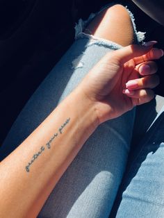 a woman's arm with a small tattoo on it that says, i love you