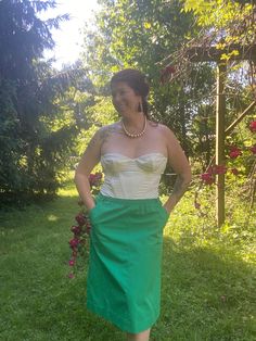 Women's Vintage 1970's Grass Green Knee Length Skirt *Size Large* $40 Handmade and so comfortable! The skirt is simple yet striking. I replaced the elastic waistband with a new one. The skirt has pockets! Belt loops for a matching belt that is included (though I had a hard time getting the belt into the loops?)! This skirt screams, Saint Patrick's Day to me but she is also ready for Spring and warmer days! Waist: 30"-32" Skirt Length: 27" from waistband to hem Fabric: 100% cotton Clothing Care: Fitted Full Maxi Skirt With Elastic Waistband, Retro Pencil Skirt Bottoms For Summer, Retro Flowy Lined Skirt Bottoms, Retro Summer Pencil Skirt Bottoms, Retro Fitted Maxi Skirt For Spring, Retro Fitted Midi Skirt, Retro Green Long Skirt Bottoms, Retro High Waist Stretch Skirt, Fitted Skirt With Elastic Waistband For Daywear