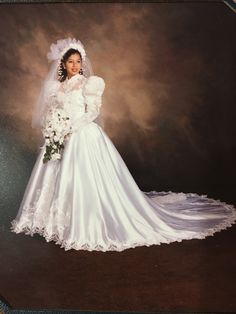 an old photo of a woman in a wedding dress