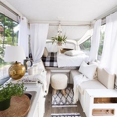 the interior of a camper is clean and ready to be used as a bed