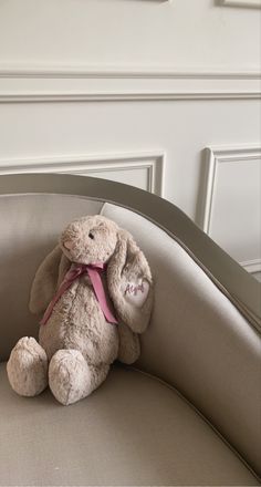 a stuffed animal sitting on top of a chair