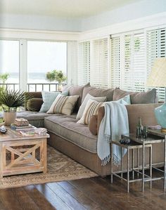 a living room filled with furniture and lots of different color schemees on the walls