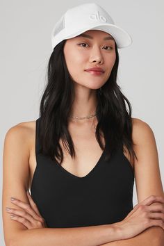 The elevated version of your classic cap, our District Trucker Hat has an Alo embroidered logo and mesh back with adjustable snap closure. Embroidered logo patch Mesh detail Adjustable snap back closure Black Bucket Hat, Black Seamless, Tank Top Bras, Womens Capris, Yoga Accessories, White Hat, Back Women, Snap Back, Alo Yoga